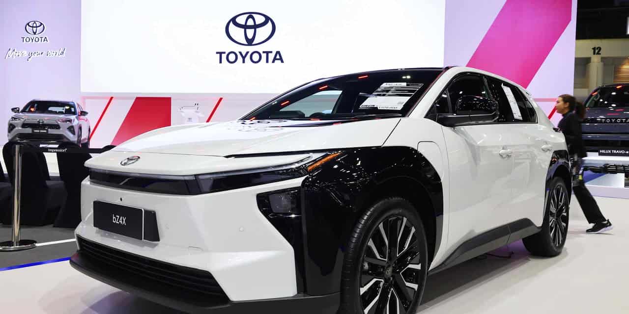 Toyota revises full-year net profit forecast upward, helped by weak yen