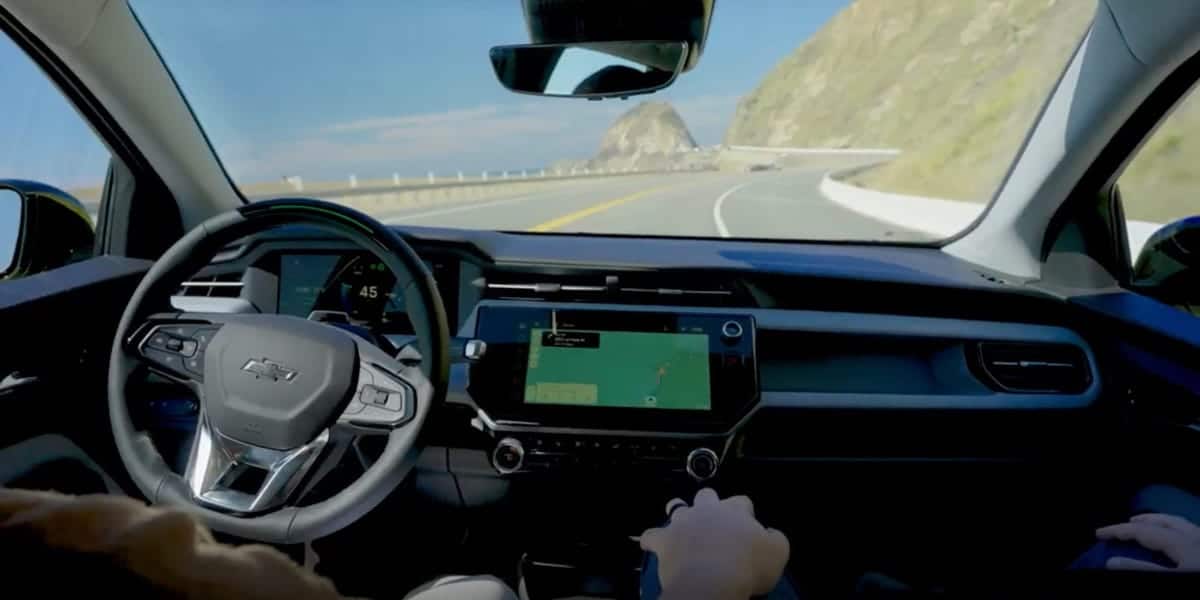 GM aims for mass-market self-driving tech, hires from rivals