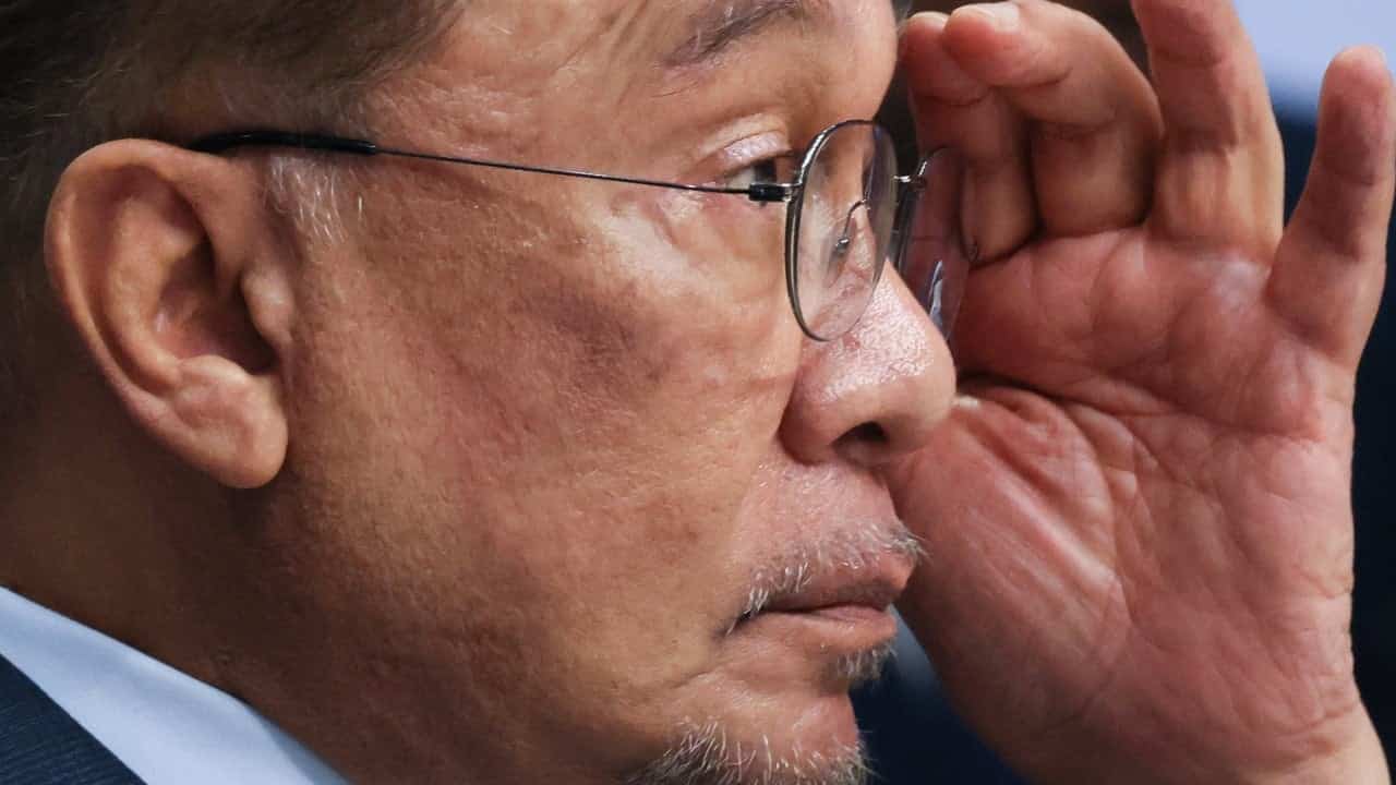 Malaysia's Anwar slams 'political drama' after opposition walks out of Tabung Haji debate