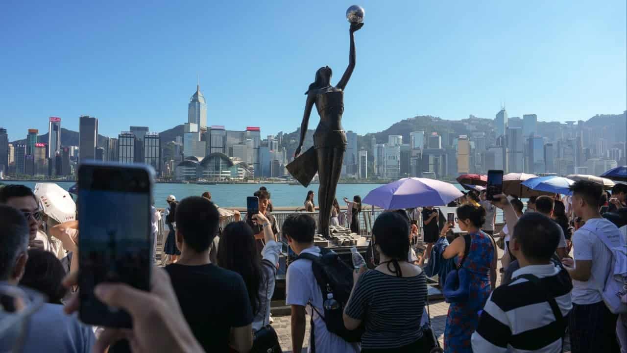 Mainland Chinese photographers advertise services in Hong Kong despite visa restrictions