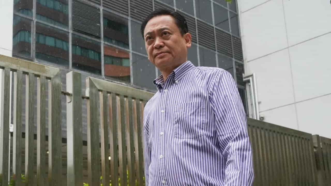 Couple accused of fraud await trial, barred from leaving Hong Kong
