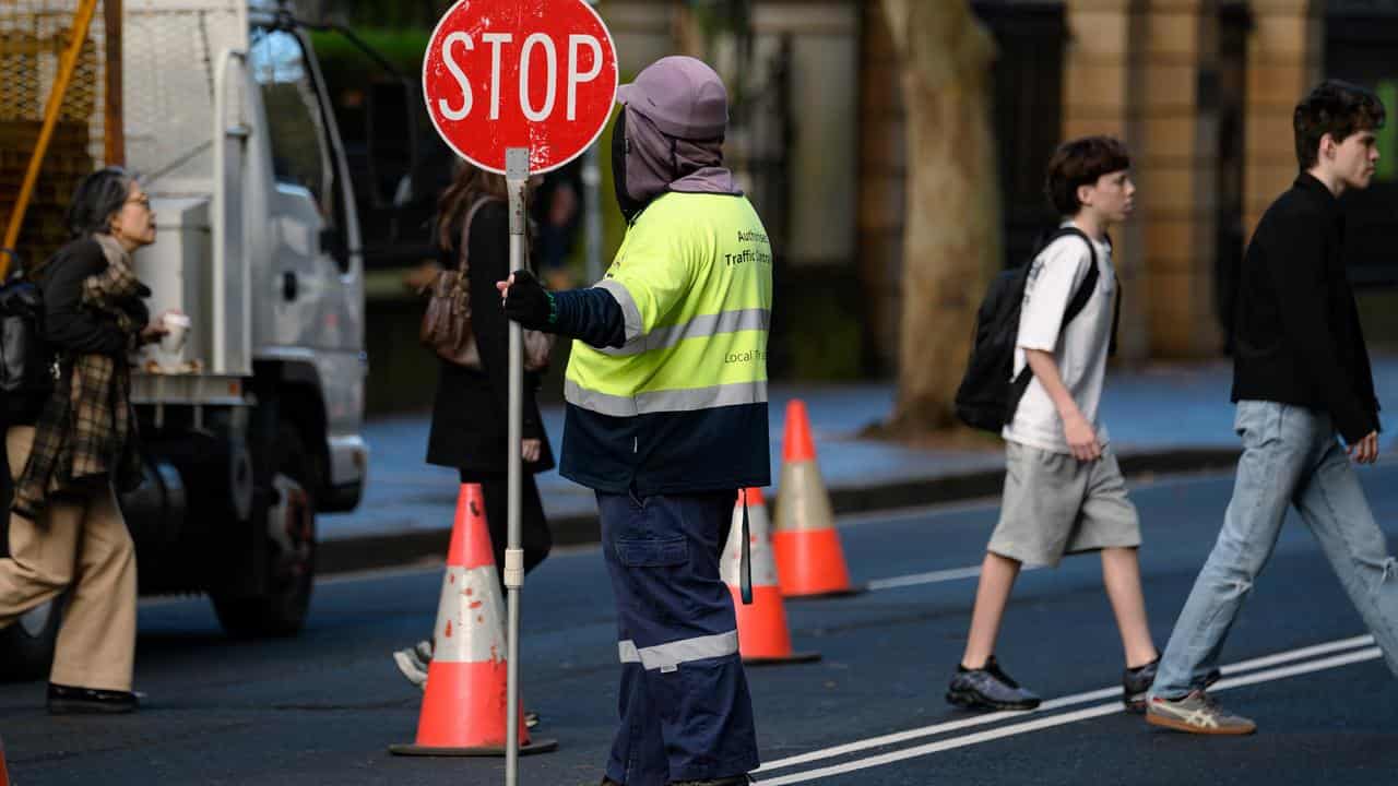 Australia jobs surge in June, unemployment steady as more look for work
