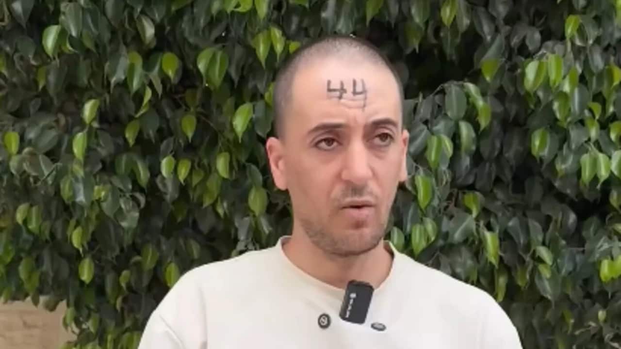 Israeli soldiers mark Palestinian detainees with numbers