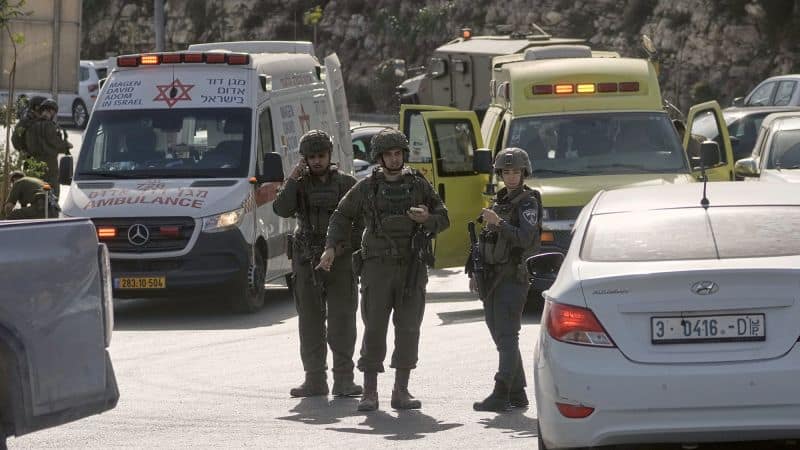 Five Israelis wounded, two attackers killed in West Bank shooting