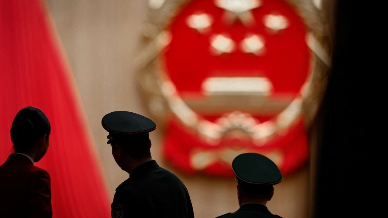 China removes generals, ex-regulator, Politburo member from lawmaker posts