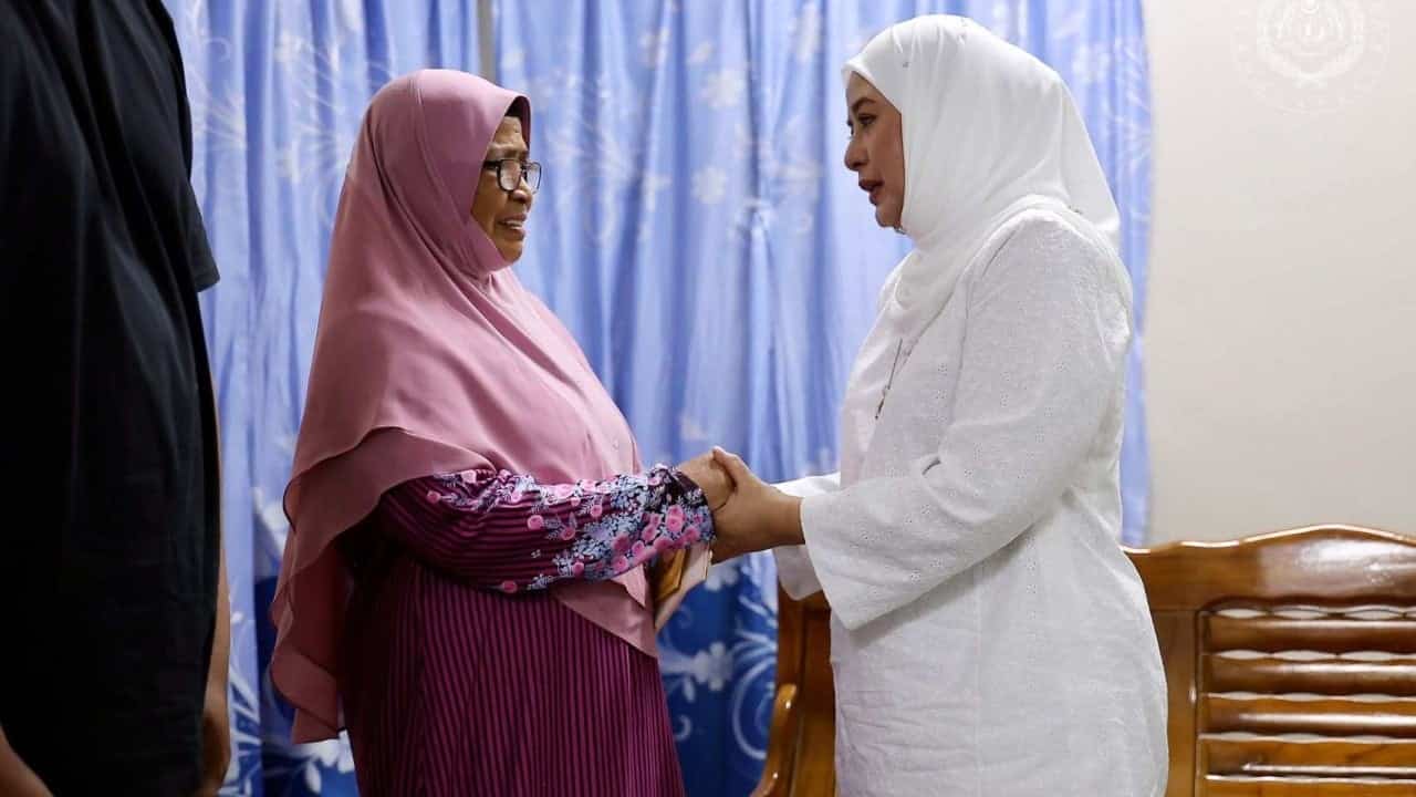 Malaysia's queen comforts family of girl found dead at school, pledges to get justice