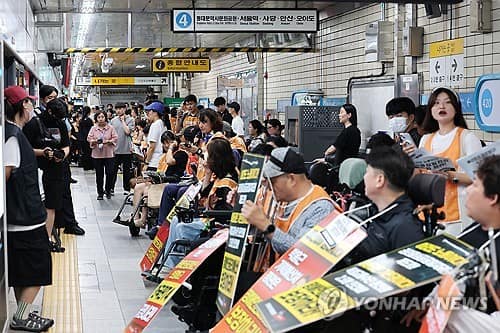 Disability rights activists protest, briefly disrupt Seoul subway
