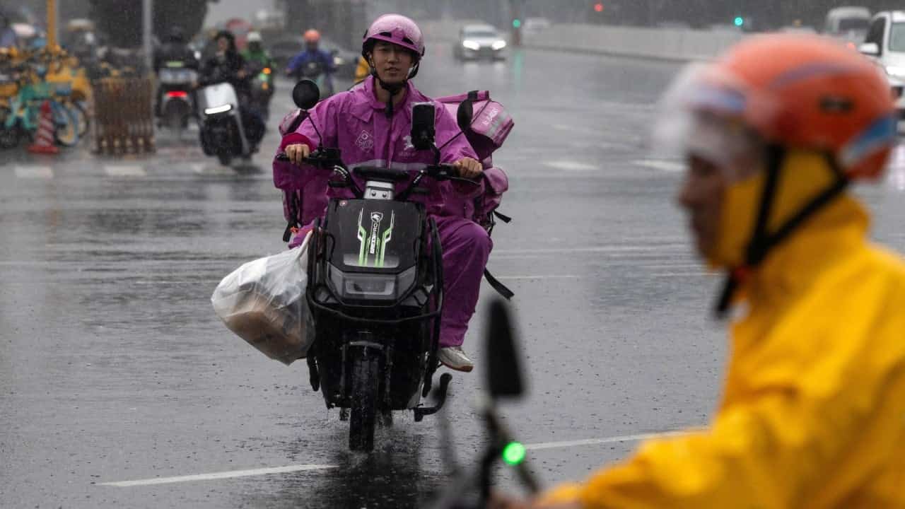 China's Tech Giants Integrate AI Into Delivery Rider Helmets