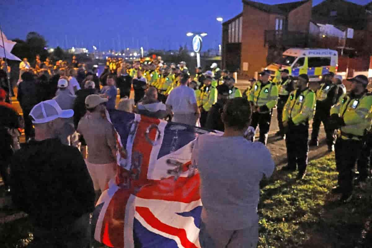 Migrants cross Channel as protesters scuffle with police in Gosport