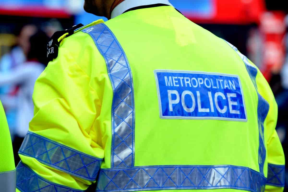 Man charged with stabbing officer during London raid