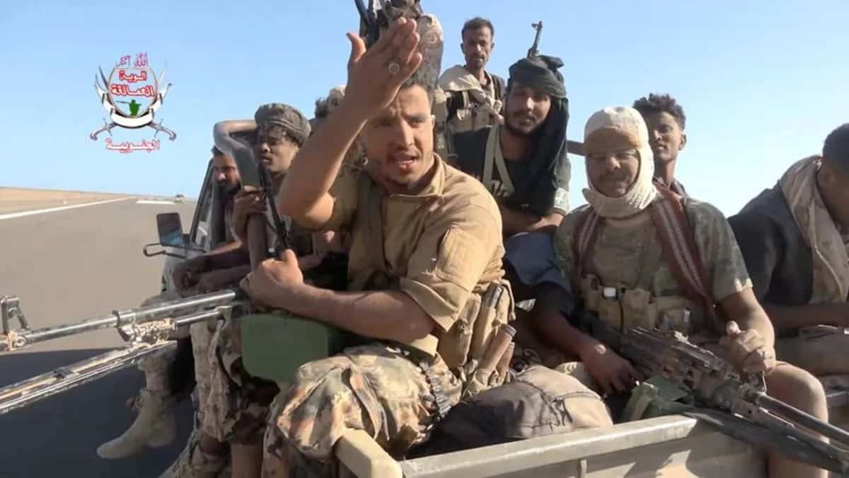 Yemeni government forces drive vehicles over Houthi fighters near Bab el-Mandeb Strait