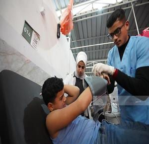 Israeli drone strike injures three in central Gaza