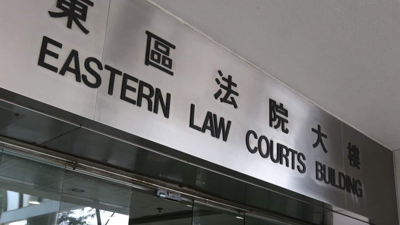 Hong Kong woman acquitted of protest-related charges after return from Australia