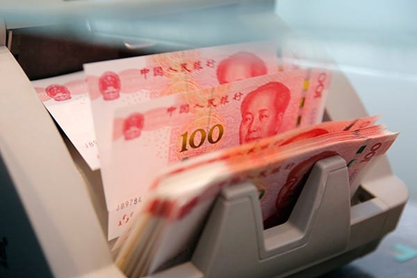 China vows to boost yuan's global use, keep exchange rate stable