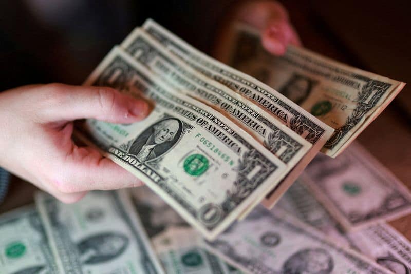 Dollar hits 13-month high as Fed rate hike bets, stock rout boost demand