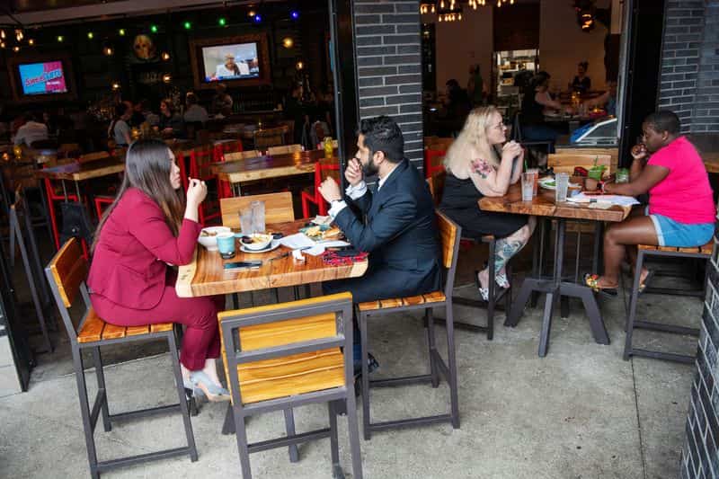 US service sector growth slows in June; employment rebounds