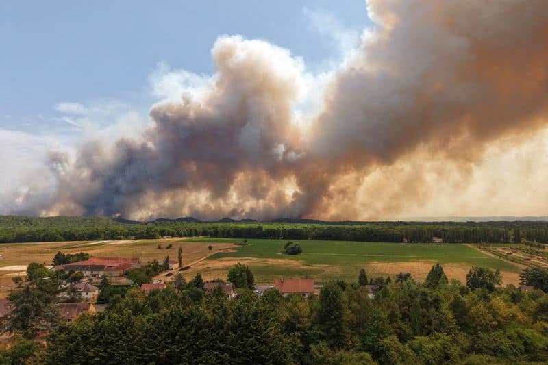 Two arrested over Paris wildfire as Spain death toll climbs