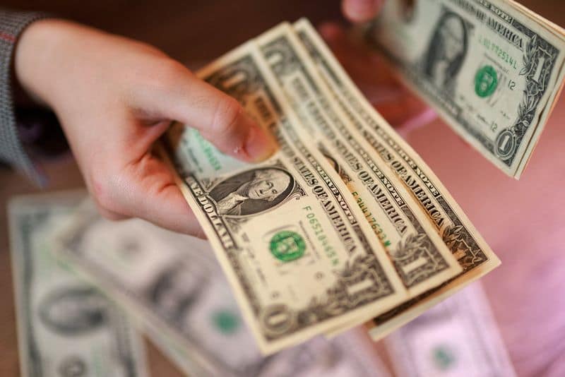Dollar Holds Steady Above One-Month Low on Inflation Data, Mideast Tensions