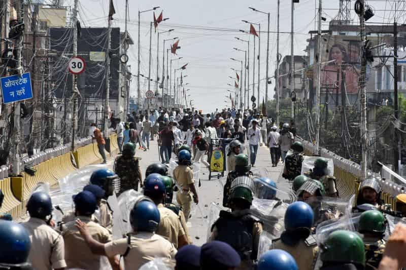 India suspends policeman for firing AK-47 at student protesters