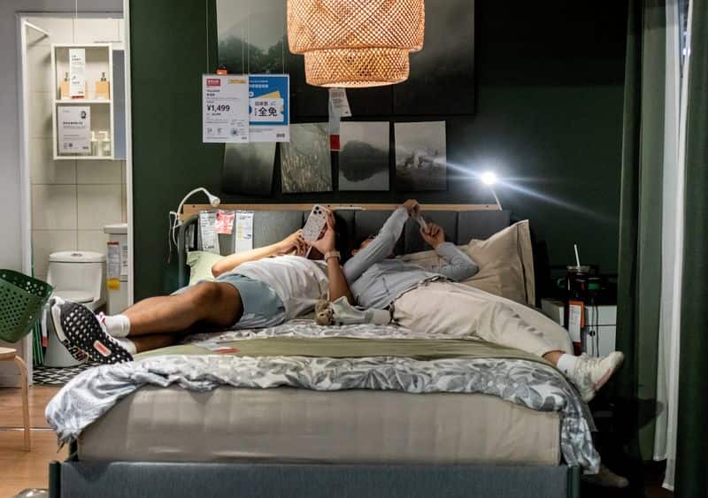 China's young workers share beds to cope with economic squeeze