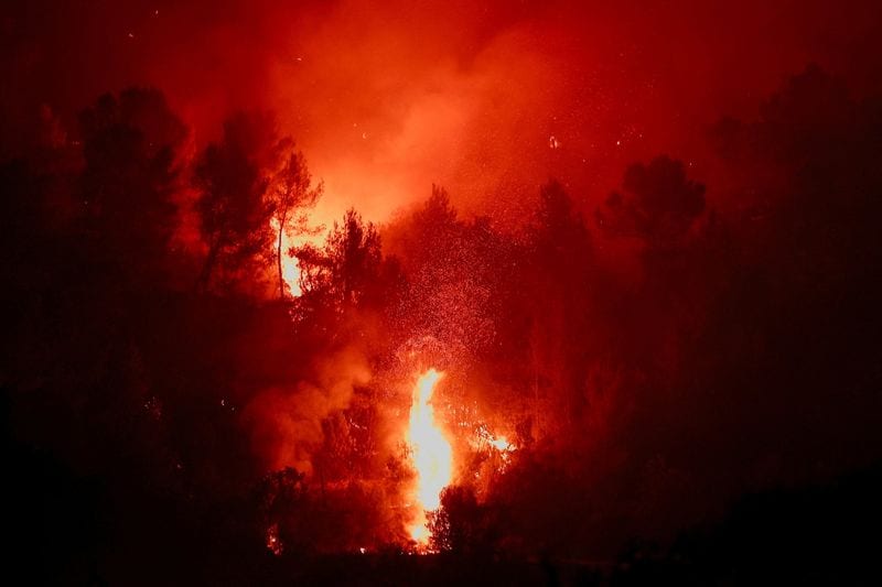 Wildfires rage across Greece and Europe amid heatwaves, prompting evacuations