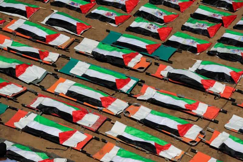 Gaza families bury 112 victims of November 2023 Israeli air strikes