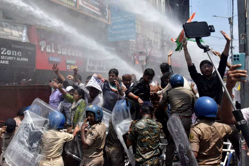 Indian police use water cannon at protest over exam leak allegations