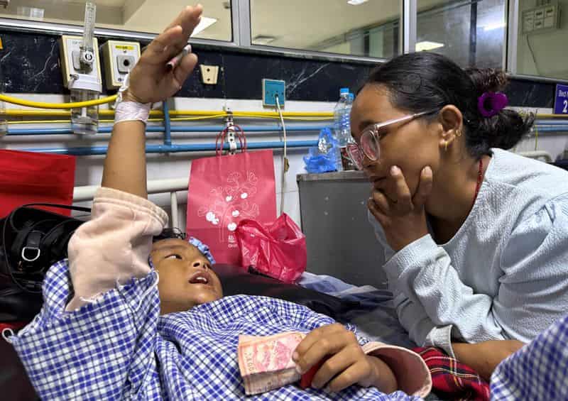 Mother reunited with 8-year-old who climbed trees to survive Nepal floods