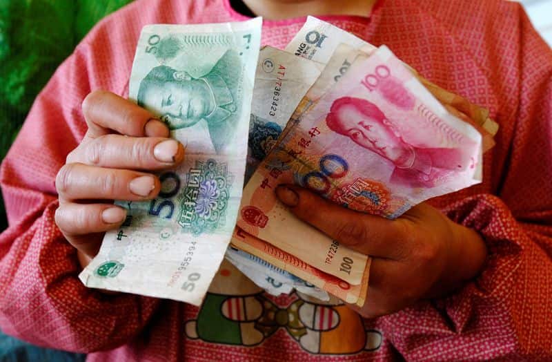 China slows yuan rally amid weak domestic demand