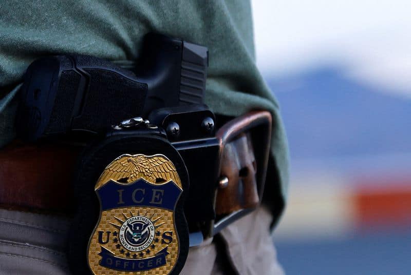 ICE officer charged with lying in shooting of Venezuelan man
