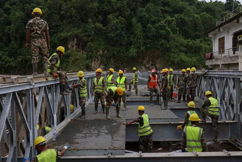 Nepal rescuers focus on workers trapped in three tunnels after flood