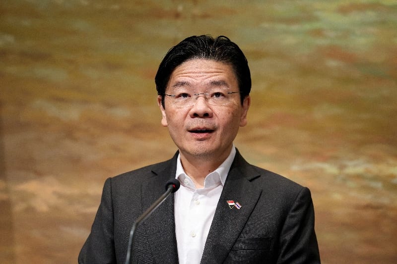Singapore PM defends pay hike, Trump earns $400,000