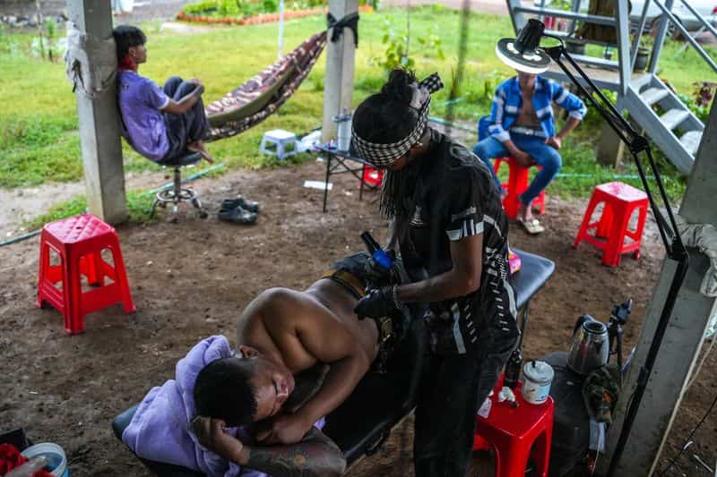Cambodian tattooist mourns lost trade as border conflict displaces thousands