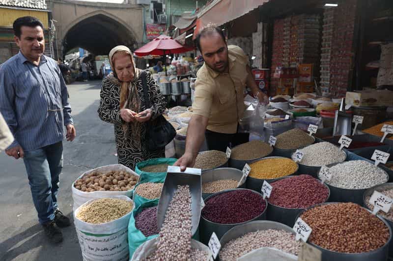Iranians struggle with soaring costs amid war and sanctions