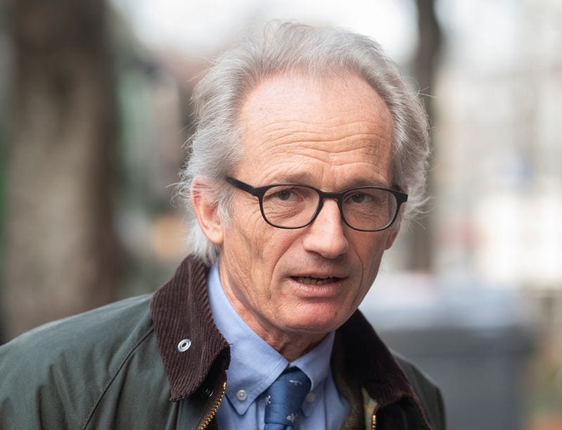 Swiss journalist charged with violating banking secrecy over banker's trial