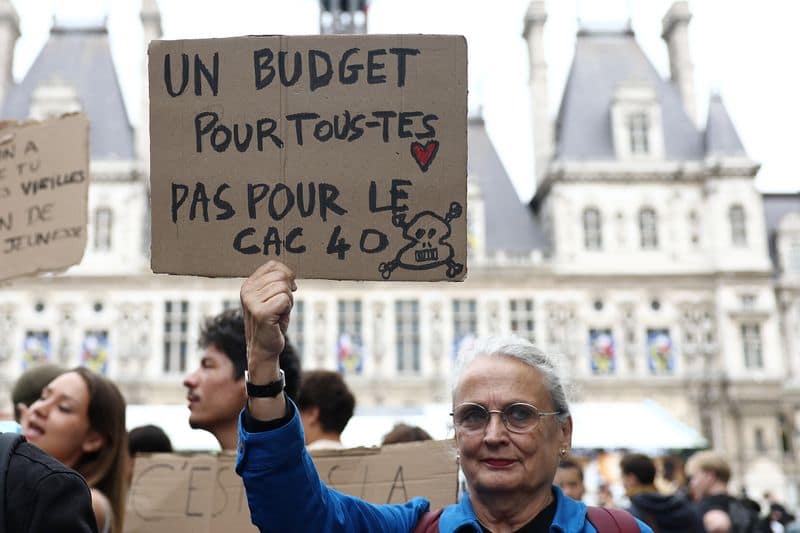 French stocks slide as protests rock Europe