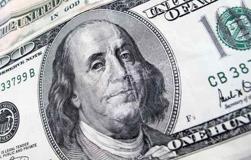 Dollar dips as US yields, crude fall; Aussie gains on hawkish RBA