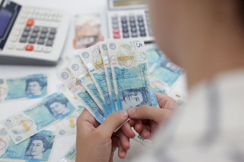 Pound edges higher, outperforming as investor nerves rattle euro zone markets